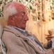Winter Fuel Rebate image: Elderly gentleman relaxing in a chair with a newspaper